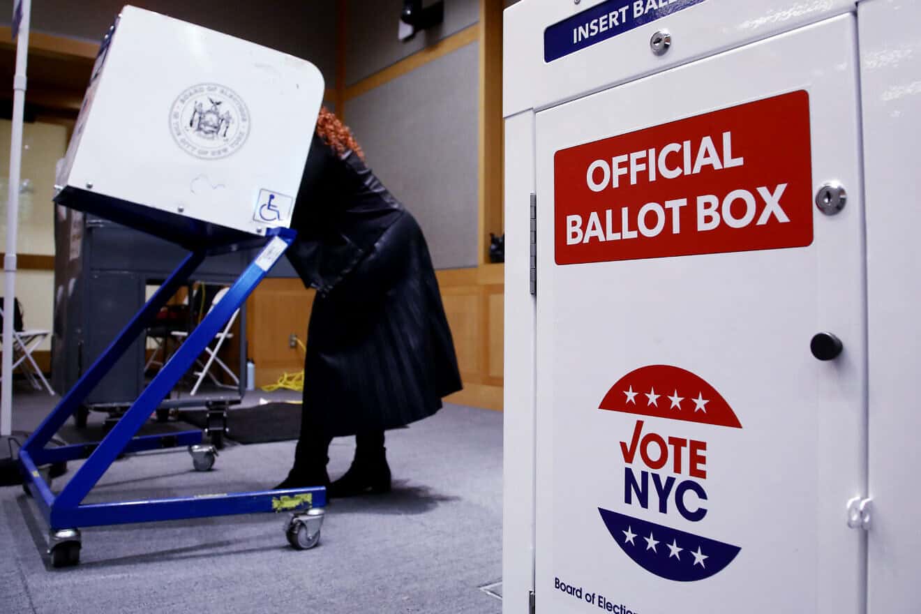 Voters fill out their ballots at a polling station in New York City on Election Day, Nov. 5, 2024. Photo by Leonardo Munoz/ AFP via Getty Images.
