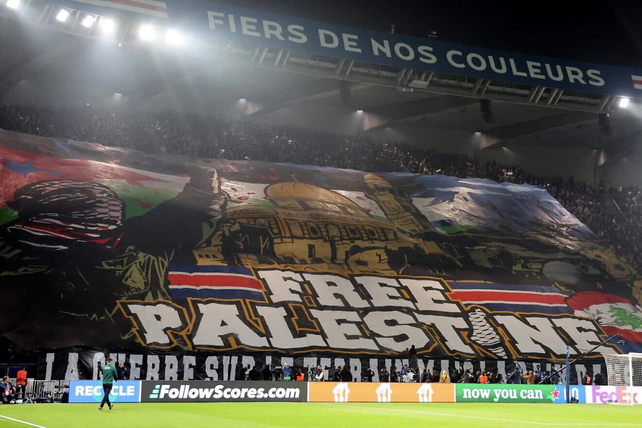 Ultra fans of Paris Saint-Germain unroll a "Free Palestine" banner during the UEFA Champions League 2024/25 League Phase MD4 match between Paris Saint-Germain and Atletico de Madrid at Parc des Princes on Nov. 6, 2024 in Paris, France. Photo by Xavier Laine/Getty Images.