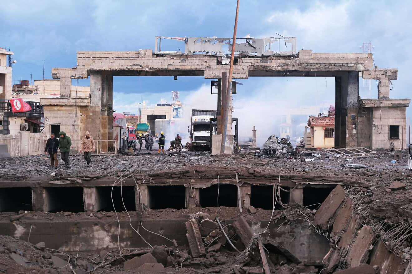 Syrian officials inspecting the damage on the Syrian side of the Al-Arida border crossing with Lebanon, Nov. 27, 2024. Photo by Ibrahim Chalhoub/AFP via Getty Images.