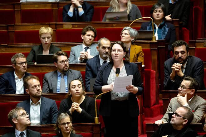 Cyrielle Chatelain MP, chairwoman of the Ecologist and Social Group and member of the left-wing opposition coalition Nouveau Front Populaire NFP, questions French Prime Minister Michel Barnier on the decision by the International Criminal Court to issue an international arrest warrant for Israeli Prime Minister Benjamin Netanyahu and former defense minister Yoav Gallant, in the hemicycle of the Assemblee Nationale in Paris, France, on Nov. 26, 2024. Photo by Amaury Cornu/Hans Lucas/ AFP via Getty Images.