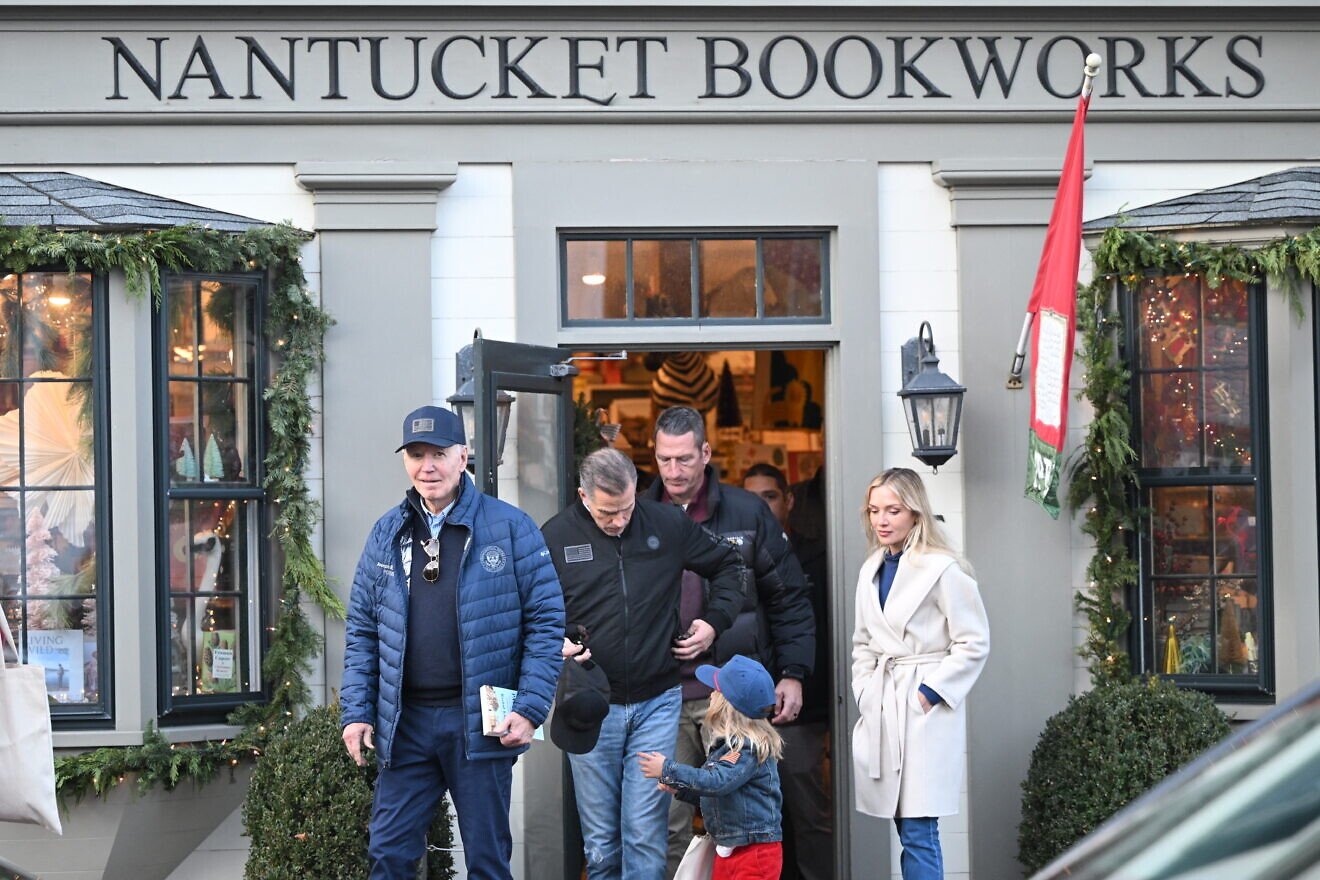 U.S. President Joe Biden walks out of Nantucket Bookworks with his son Hunter Biden, grandson Beau and daughter-in-law Melissa Cohen Biden in Nantucket, Mass., on Nov. 29, 2024. He is carrying the book “The Hundred Years’ War on Palestine” by Rashid Khalidi. Photo by Mandel Ngan/AFP via Getty Images.