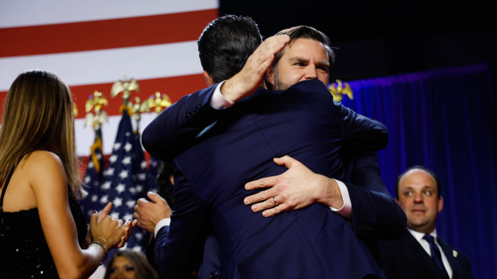 U.S. Vice President-elect JD Vance hugs Donald Trump Jr. during an election night event at the Palm Beach Convention Center in Florida, Nov. 6, 2024. Photo by Chip Somodevilla/Getty Images.
