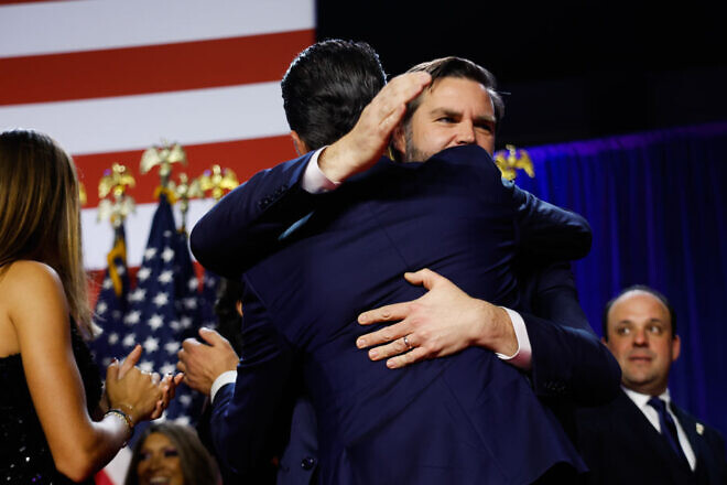 U.S. Vice President-elect JD Vance hugs Donald Trump Jr. during an election night event at the Palm Beach Convention Center in Florida, Nov. 6, 2024. Photo by Chip Somodevilla/Getty Images.