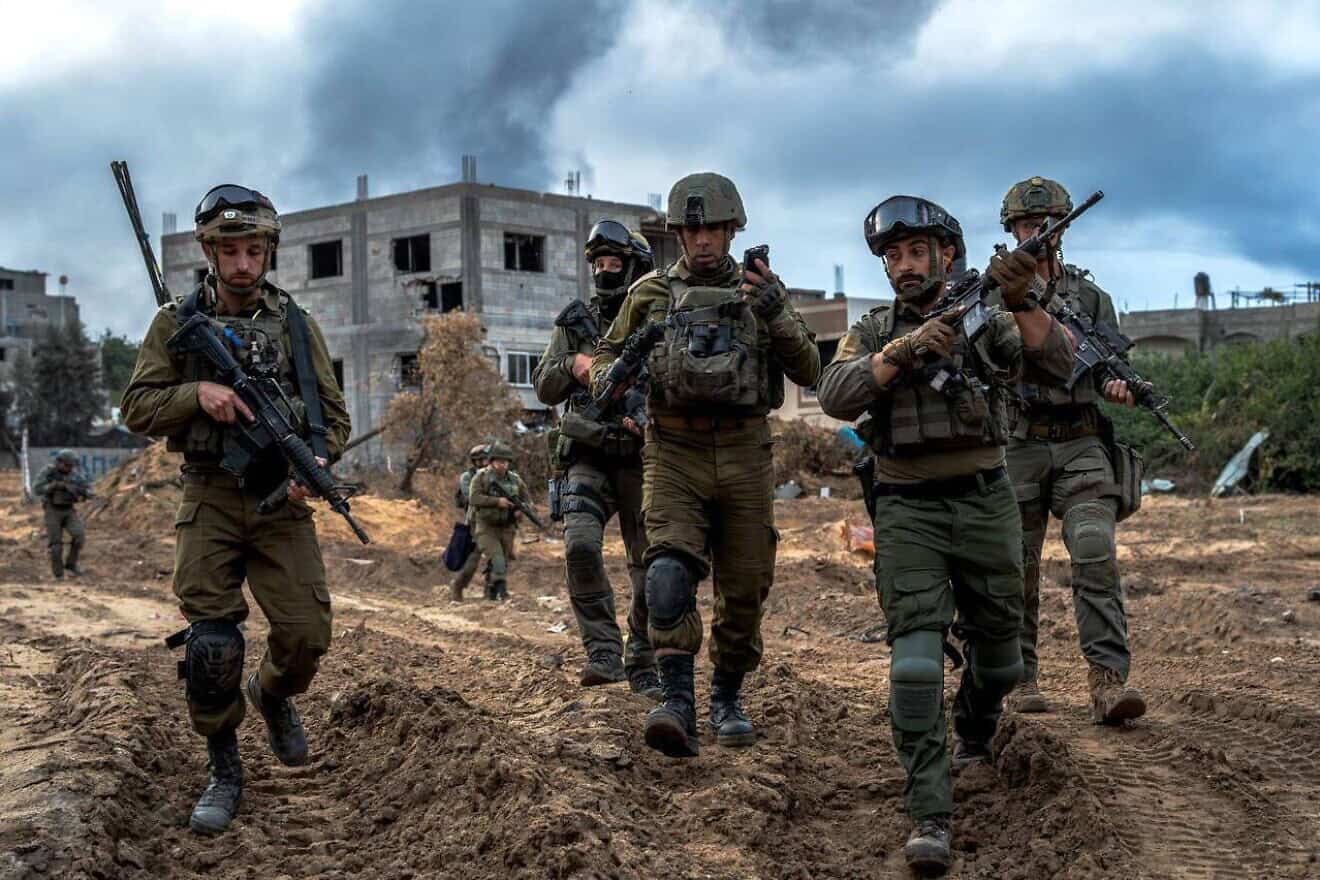 Brig. Gen. Itzik Cohen (center), commander of the IDF's 162nd Division, walks with other officers in Jabalia, the northern Gaza Strip, December 2023. Credit: IDF. Brig. Gen. Itzik Cohen (center), commander of the IDF's 162nd Division, walks with other officers in Jabalia, the northern Gaza Strip, December 2023. Credit: IDF.