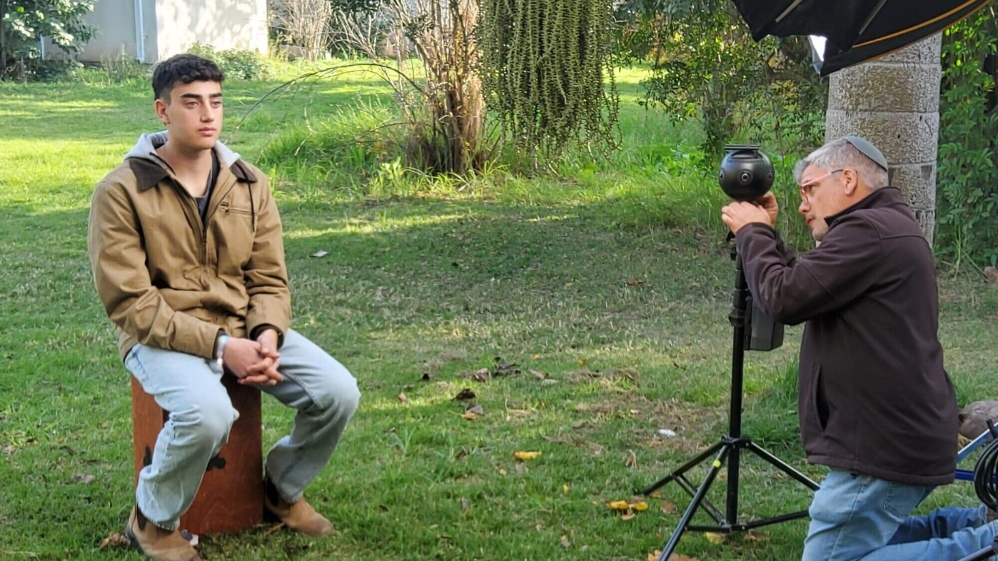 Released hostage Ofir Engel being filmed at Kibbutz Be'eri for the Survived to Tell-Be the Witness VR project, January 2024. Credit: Survived to Tell-Be the Witness.