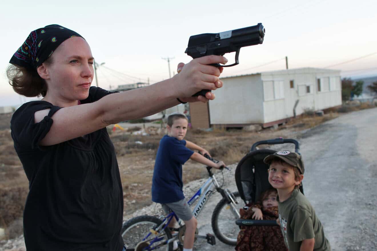 A woman practices aiming her weapon at Pnei Kedem in Gush Etzion, Judea, on Sept. 21, 2011. Photo by Nati Shohat/Flash90.