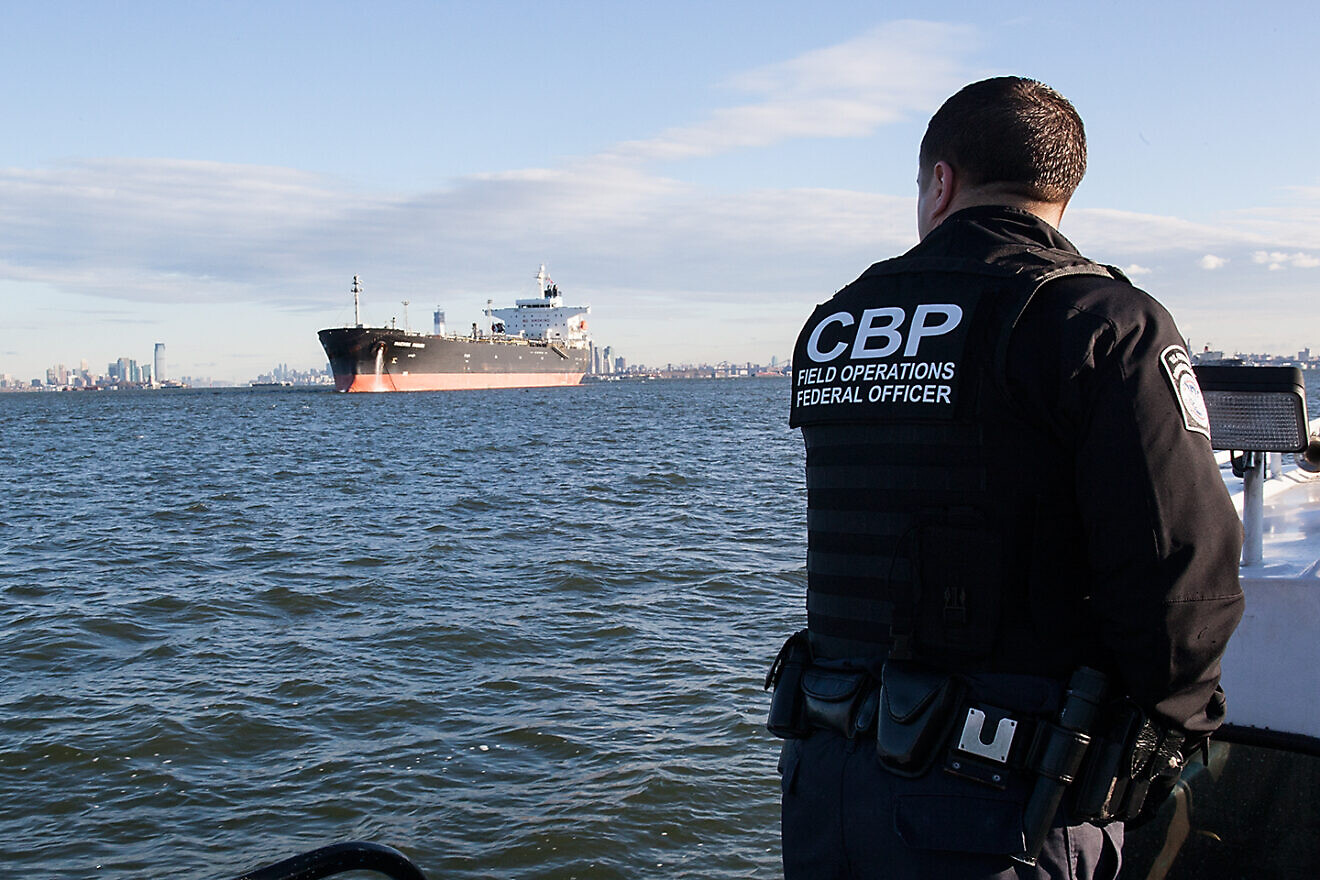 A U.S. Customs and Border Protection officer looks out at the fuel tanker upon which he and another officer are about to board and do a crew immigration inspection, Port of New York/Newark, Nov. 3, 2012. Credit: Josh Denmark/U.S. Customs and Border Protection.
