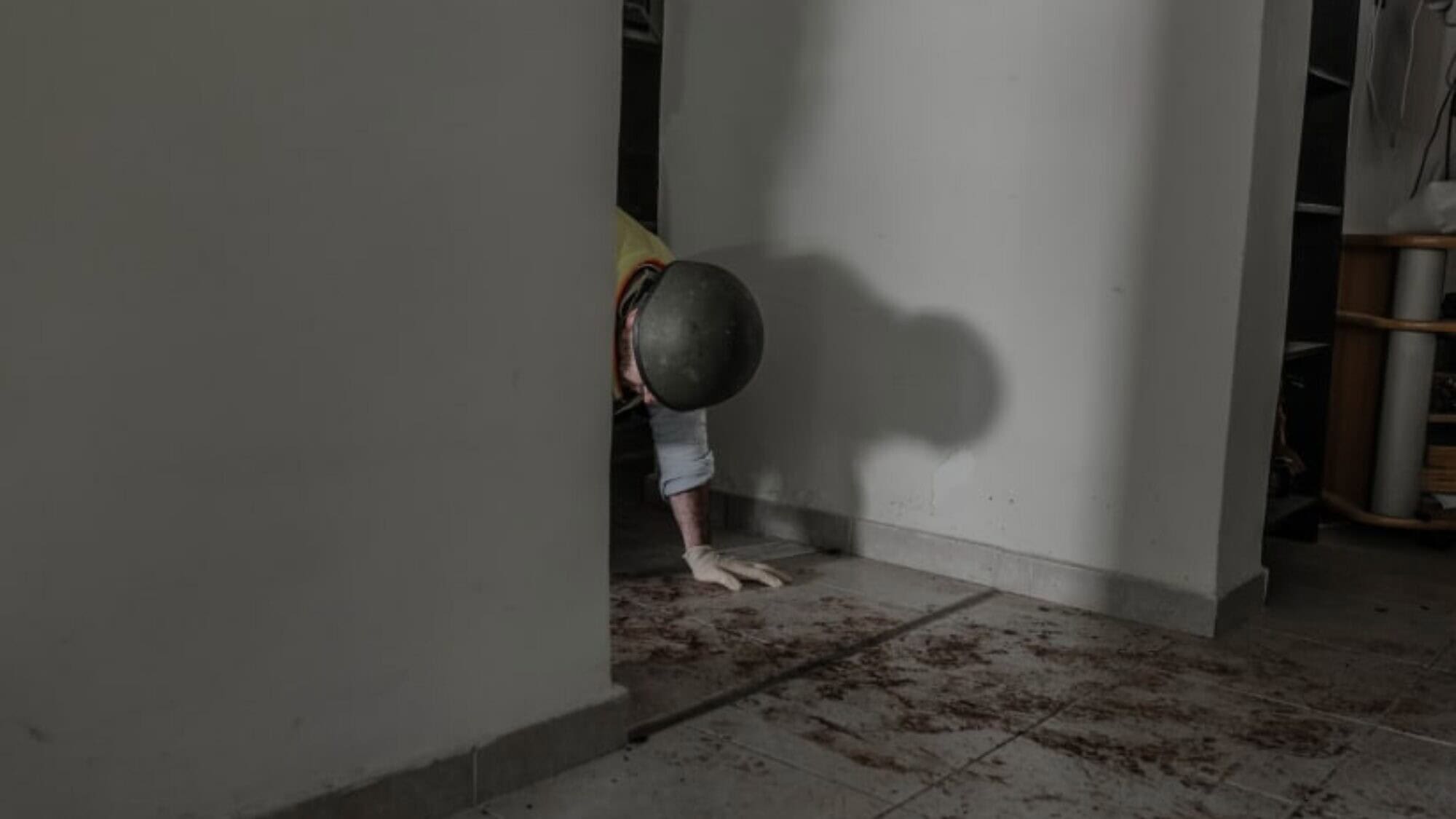 “Photo of the Year”: A ZAKA volunteer collecting human remains from where a man was murdered by Hamas terrorists on Oct. 7, 2023, at Kibbutz Be'eri on Nov. 5, 2023. Photo by Chen Schimmel/Israel Hayom.