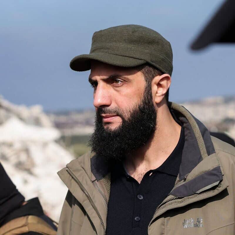 Hayat Tahrir al-Sham chief Abu Mohammad al-Julani checks the damage following an earthquake in Besnaya, in Syria's rebel-held northwestern Idlib Province at the border with Turkey, on Feb. 7, 2023. Photo by Omar Haj Kadour/AFP via Getty Images.