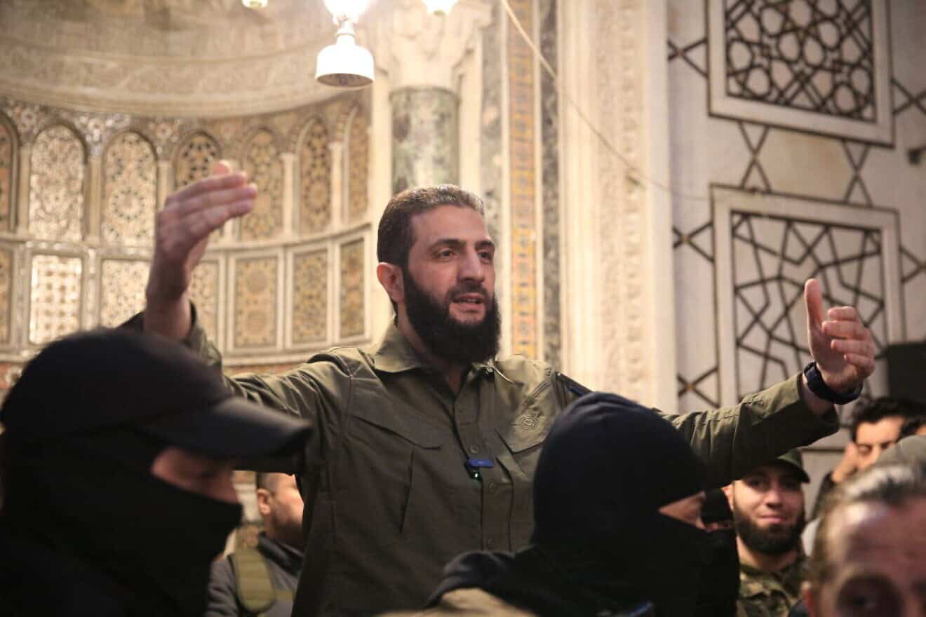 Ahmed al-Sharaa, aka Abu Mohammed al-Jolani, the leader of Hayat Tahrir al-Sham (HTS), addresses a crowd at the Umayyad Mosque in Damascus, Dec. 8, 2024. Photo by Aref Tammawi/AFP via Getty Images.