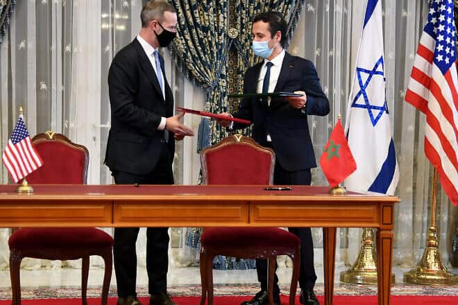 Adam Boehler (left) in Morocco as part of a joint U.S.-Israeli delegation to Rabat to meet with King Mohammed VI and other officials, and to sign various Memorandums of Understanding (MoUs), Dec. 22, 2020. Credit: David Azagury/U.S. Embassy Jerusalem via Wikimedia Commons.