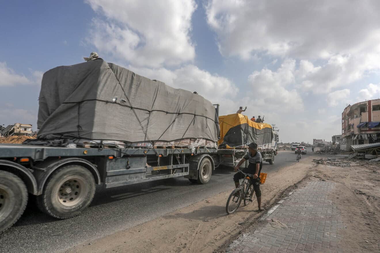 Trucks loaded with International humanitarian aid enter Gaza through the Israeli Kerem Shalom Crossing, in the southern Gaza Strip, on July 1, 2024. Photo by Abed Rahim Khatib/Flash90.