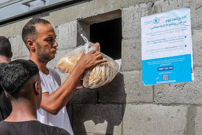 A Gazan buys bread at a bakery run by the World Food Programme and UNRWA in Khan Yunis, on Sept. 8, 2024. Photo by Abed Rahim Khatib/Flash90.