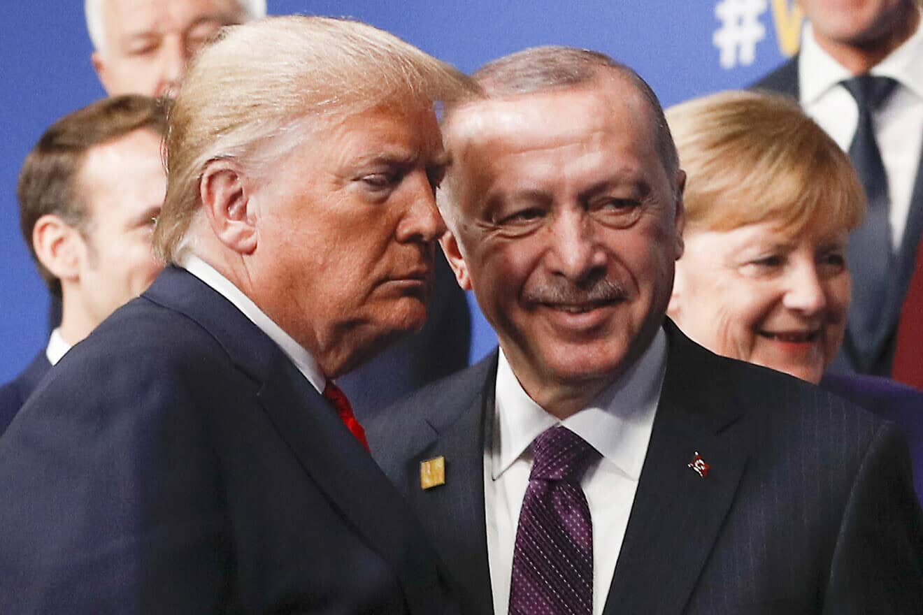 U.S. President Donald Trump (L) and Turkey's President Recep Tayyip Erdogan (R) leave the stage after the family photo to head to the plenary session at the NATO summit at the Grove hotel in Watford, northeast of London on Dec. 4, 2019. Photo by Peter Nicholls/POOL/AFP via Getty Images.