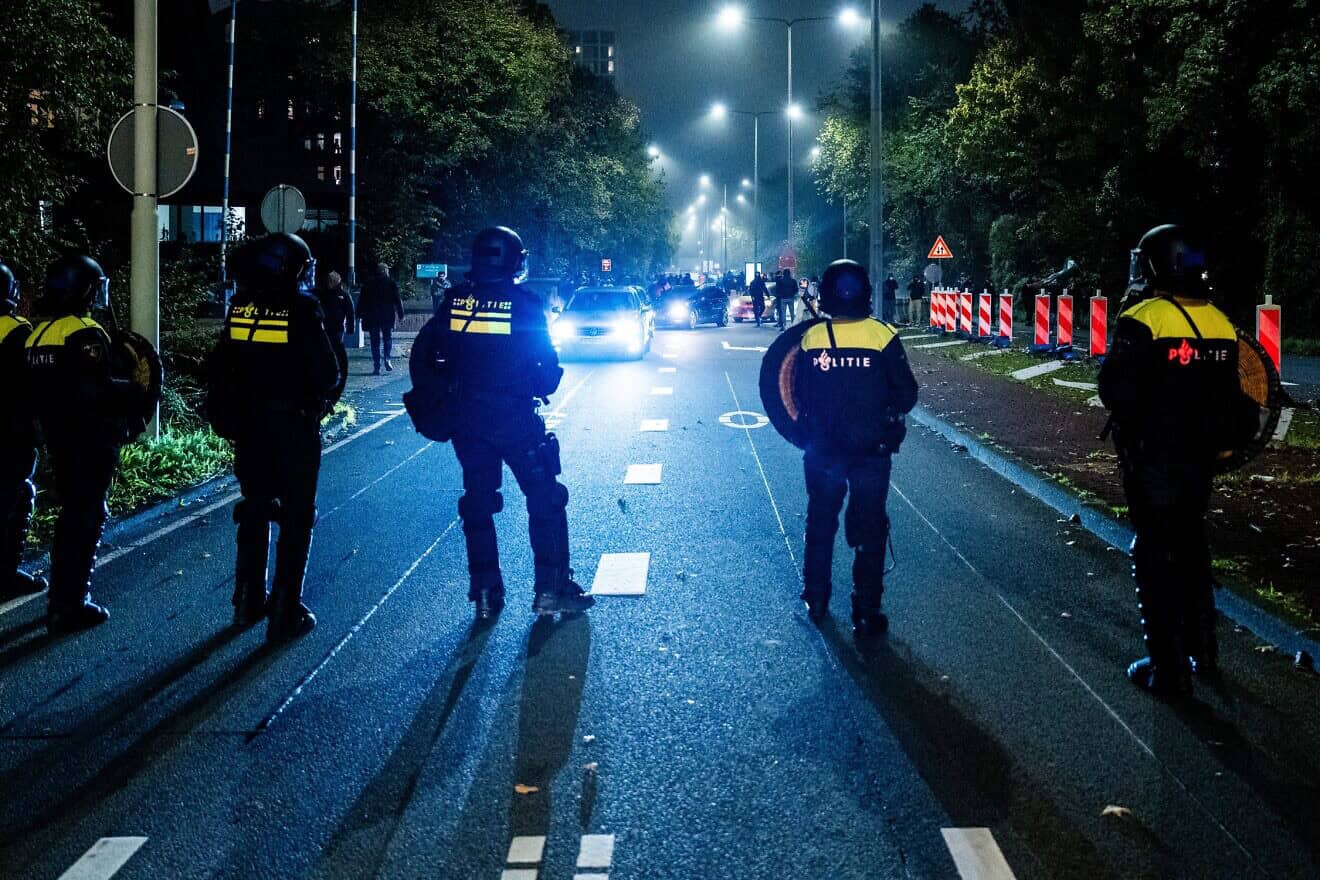 Police officers from the Mobile Unit (ME) during a pro-Palestinian demonstration on the sidelines of the UEFA Europa League football match between Ajax Amsterdam and Maccabi Tel Aviv, in Amsterdam on Nov. 7, 2024. Photo by Jeroen Jumelet/ANP/AFP via Getty Images.