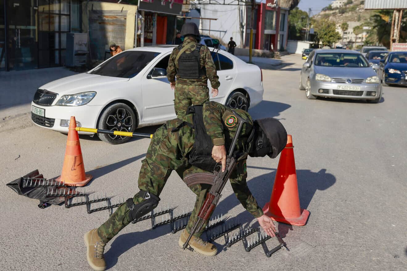 Palestinian Authority forces stop a car at a roadblock in the Samaria city of Jenin, Dec. 6, 2024. Photo by Jaafar Ashtiyeh/AFP via Getty Images.
