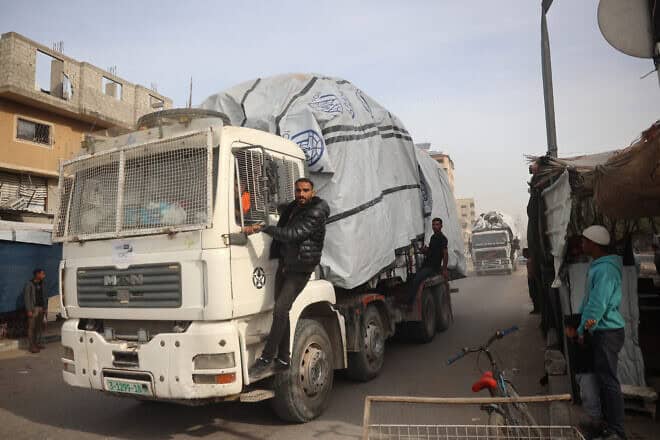 A truck carrying humanitarian aid drives on the main road in the Nuseirat camp in the central Gaza Strip, on Dec. 7, 2024. Photo by Eyad Baba/AFP via Getty Images.