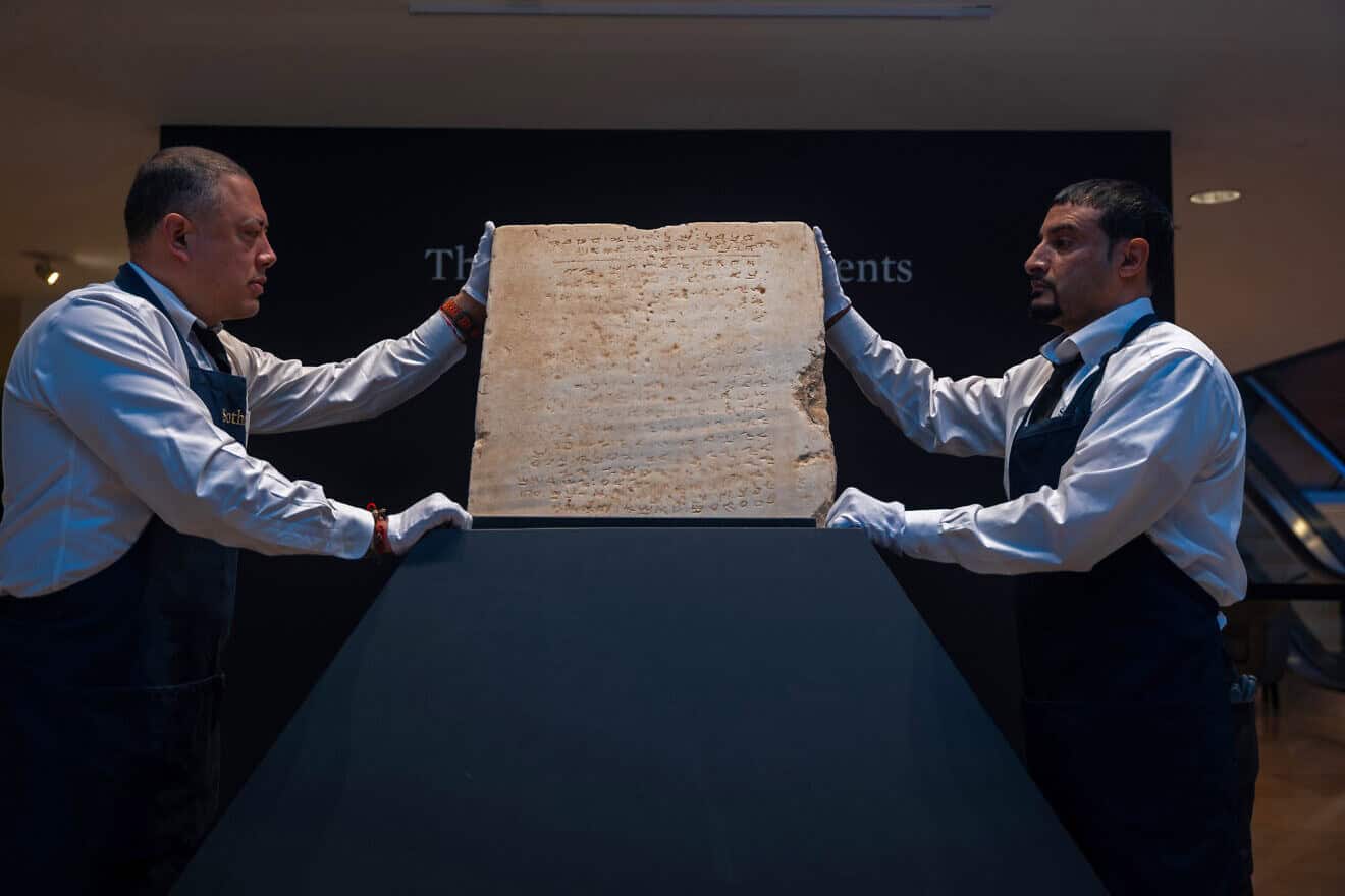 The oldest known stone tablet inscribed with the Ten Commandments, dating from 300 to 800 A.D., is displayed at Sotheby's auction house on December 9, 2024. in New York City. Photo by Spencer Platt/Getty Images.