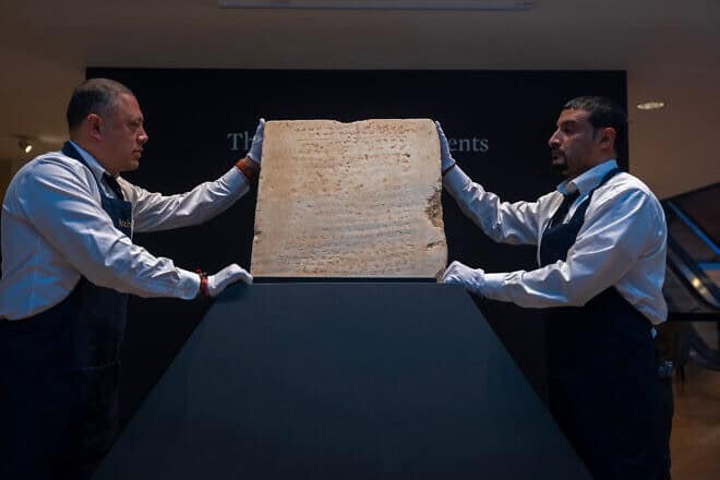 The oldest known stone tablet inscribed with the Ten Commandments, dating from 300 to 800 A.D., is displayed at Sotheby's auction house on December 9, 2024. in New York City. Photo by Spencer Platt/Getty Images.