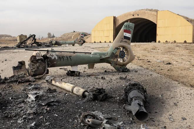 Israel carried out a drone strike on Al Mazzeh Airport, targeting ammunition supplies belonging to the National Syrian Army, causing significant damage to the facility on Dec. 11, 2024 in Damascus, Syria. Photo by Ugur Yildirim/dia images via Getty Images.