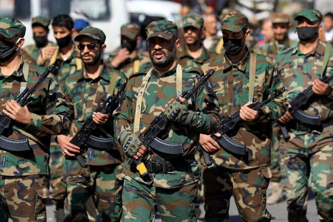 Security forces loyal to Yemen's Houthi movement march in the Houthi-run capital Sanaa in support of the Palestinians and against the United States and Israel, on Dec. 18, 2024. Photo by Mohammed Huwais/AFP via Getty Images.