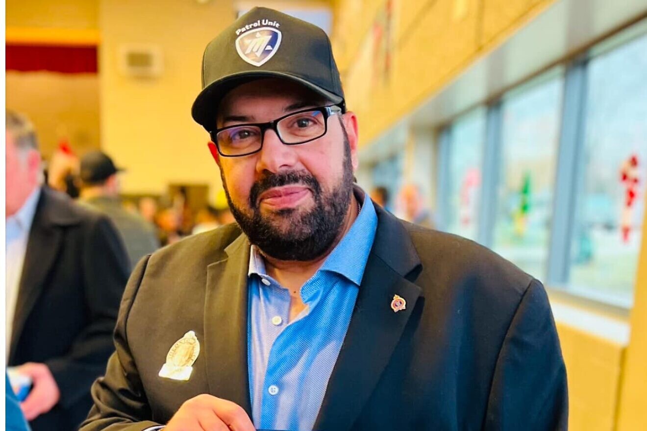 Aaron Hadida, founder of Magen Herut, holds an award that he won for community service, which was presented by Michael Kerzner, solicitor general of Ontario and a member of the provincial Parliament, on Dec. 8, 2024. Photo by Kara Desharnais.