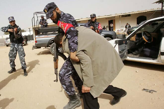 Members of Hamas's Executive Force take part in an exercise inside their base in the Rafah camp in the southern Gaza Strip, Feb. 18, 2007, Photo by Abid Katib/Getty Images.