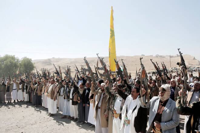 Houthi followers chant slogans as they participate in a tribal rally on the outskirts of Sanaa against Israeli and U.S. air attacks on Yemen, on Dec. 17, 2024. Photo by Mohammed Hamoud/Getty Images.