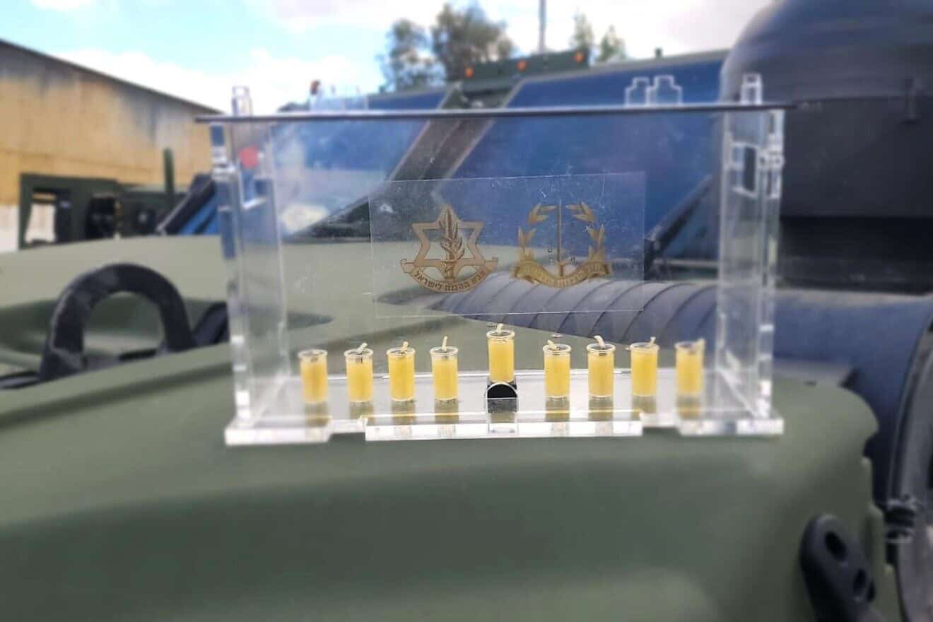 The IDF Rabbinate has produced a specially designed menorah in 2024, delivering them to soldiers in active combat zones. Credit: IDF.