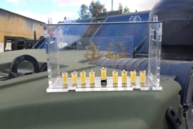 The IDF Rabbinate has produced a specially designed menorah in 2024, delivering them to soldiers in active combat zones. Credit: IDF.