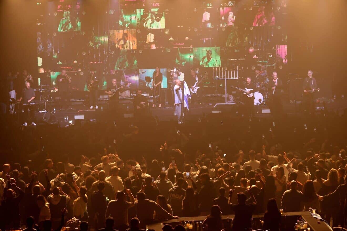 IDF soldiers enjoy the concert at Hangar 11, the Tel Aviv Port, Dec. 28, 2024.  Photo by Alex Kolomoisky/KKL-JNF.