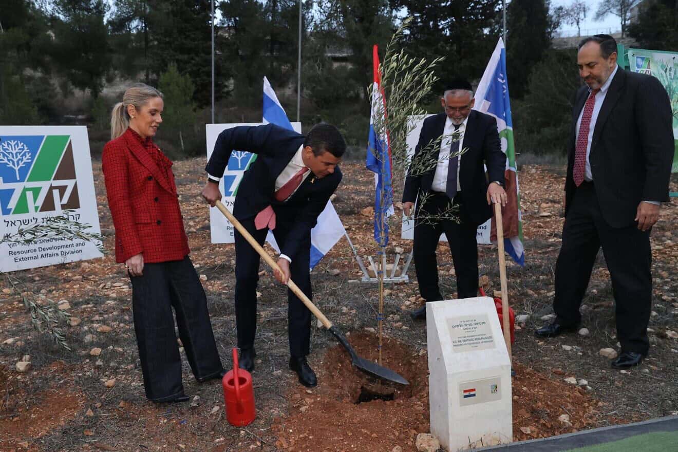 David Yaari, vice chairman of KKL-JNF (right), and Yitzhak Vaknin, co-chairman of KKL-JNF, with Santiago Peña, the president of Paraguay, as he plants a tree in Jerusalem on Dec. 11, 2024. Credit: Alex Kolomoisky/KKL-JNF Photo Archive.
