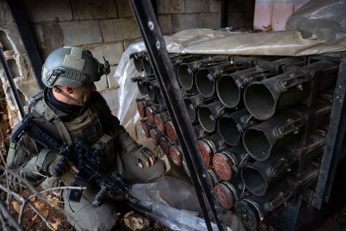 An Israeli soldier examines anti-tank ordnance seized from Hamas's Radwan Force in Southern Lebanon, Dec. 28, 2024. Credit: IDF.