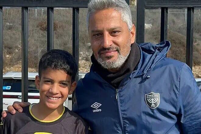 Oct. 7 survivor Yoav Roditi, 11, and Beitar Jerusalem FC coach Barak Itzchaki. Photo courtesy of Beitar Illit spokesperson.