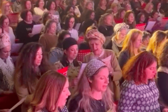 Women singing in unison at the Koolulam event organized by Momentum. Credit: Courtesy.