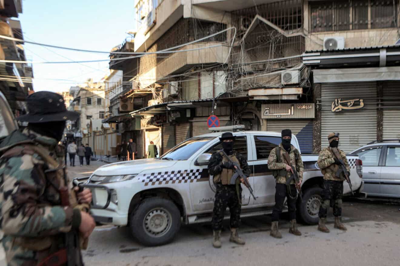 Security personnel outside the Greek Orthodox Cathedral of St. George during the Christmas morning mass in Latakia, Syria, on Dec. 25, 2024. Photo by Aaref Watad/AFP via Getty Images.