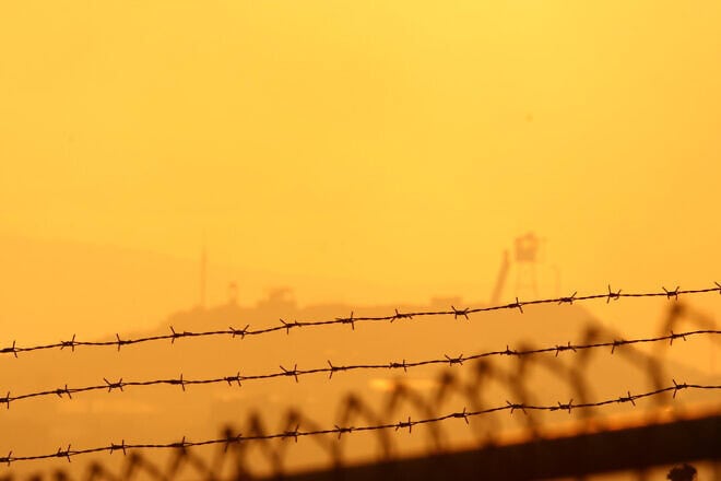 The sun sets over a United Nations outpost in Southern Lebanon, as seen from the northern Israeli town of Manara, July 24, 2006. Photo by Anna Kaplan/Flash90.