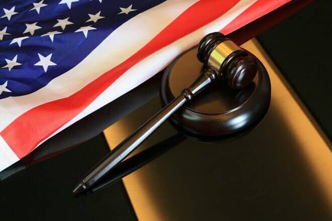 Gavel next to American flag. Credit: Sergei Tokmakov/Pixabay.