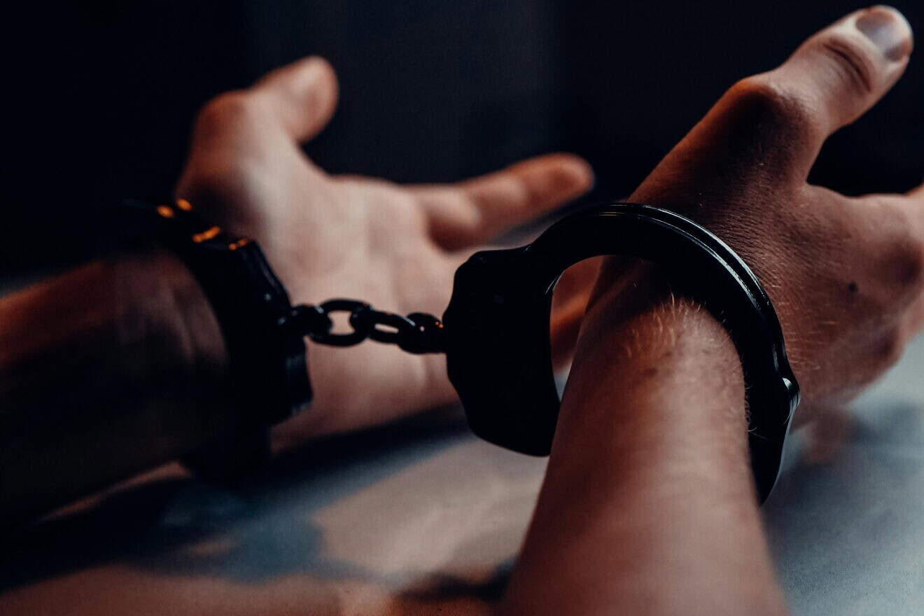 Man in handcuffs. Credit: Kindel Media/Pexels.
