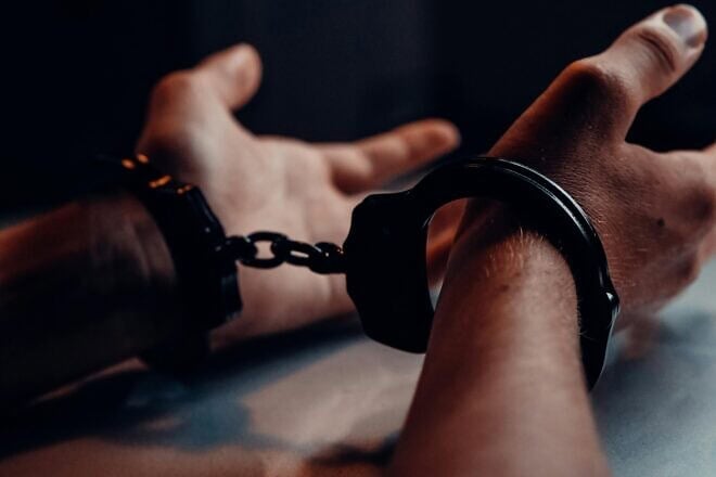 Man in handcuffs. Credit: Kindel Media/Pexels.