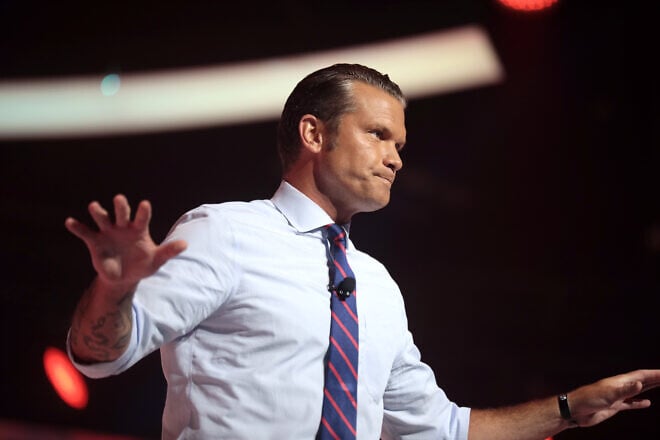 Pete Hegseth speaking with attendees at the 2022 Student Action Summit (the Hebrew name Jesus is among the tattoos visible on his arm), at the Tampa Convention Center in Florida on July 24, 2022. Photo by Gage Skidmore/Creative Commons.