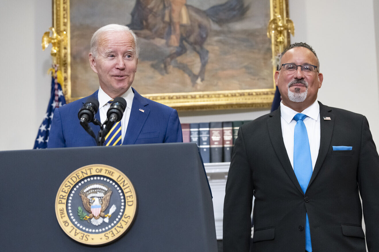 U.S. President Joe Biden and Education Secretary Miguel Cardona address student loan forgiveness, Aug. 24, 2022, in the Roosevelt Room at the White House. Credit: Erin Scott/White House.