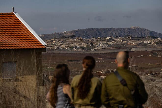 Israelis in Metula view damage from an IDF operation across the border in Lebanon, Dec. 9, 2024. Photo by Chaim Goldberg/Flash90.