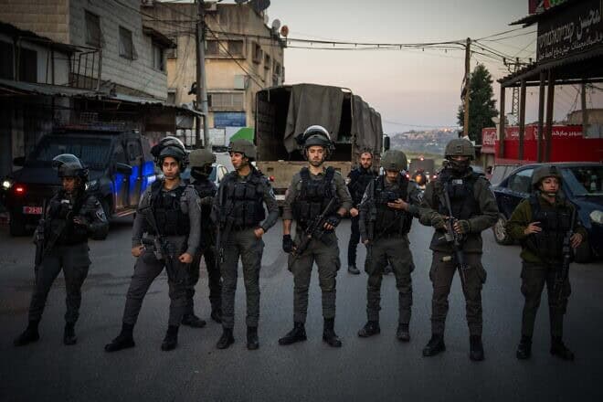 Israeli security forces in the village of al-Funduq, at the scene where three Jews were murdered in a shooting attack, Jan. 6, 2025. Photo by Erik Marmor/Flash90.