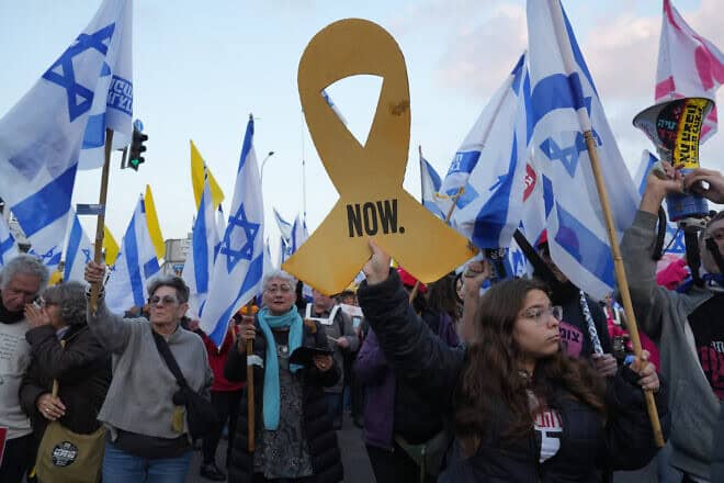 Israelis protest against the government and for the release of hostages in the Gaza Strip, at the Goma Junction in the Galilee on Jan. 11, 2025. Photo by Ayal Margolin/Flash90.