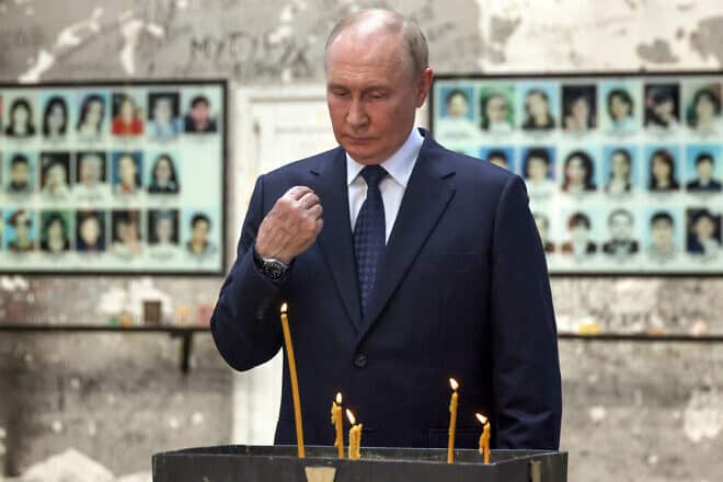 Russian President Vladimir Putin lights a candle at the site of the destroyed school in Beslan, where in 2004 Chechen militants took more than 1,000 people hostage, on Aug. 20, 2024. Photo by Sergei Karpukhin/POOL from Russian-state-owned Sputnik/via Getty Images.