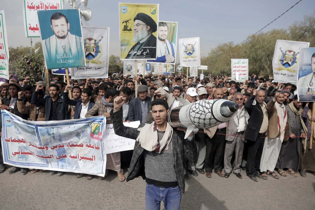 Students and staff at Sanaa University chant slogans as they protest in support of Gaza and against the U.S.-led aerial attacks on Yemen, on Jan. 8, 2024. Photo by Mohammed Hamoud/Getty Images.