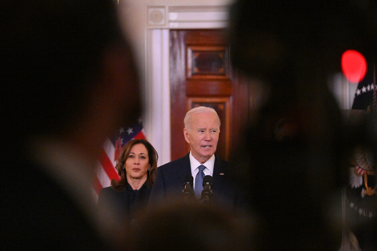 U.S. President Joe Biden, flanked by Vice President Kamala Harris, speaks about the Israel-Hamas ceasefire and hostage release deal in the Cross Hall of the White House, on Jan. 15, 2025. Photo by Roberto Schmidt/AFP via Getty Images.