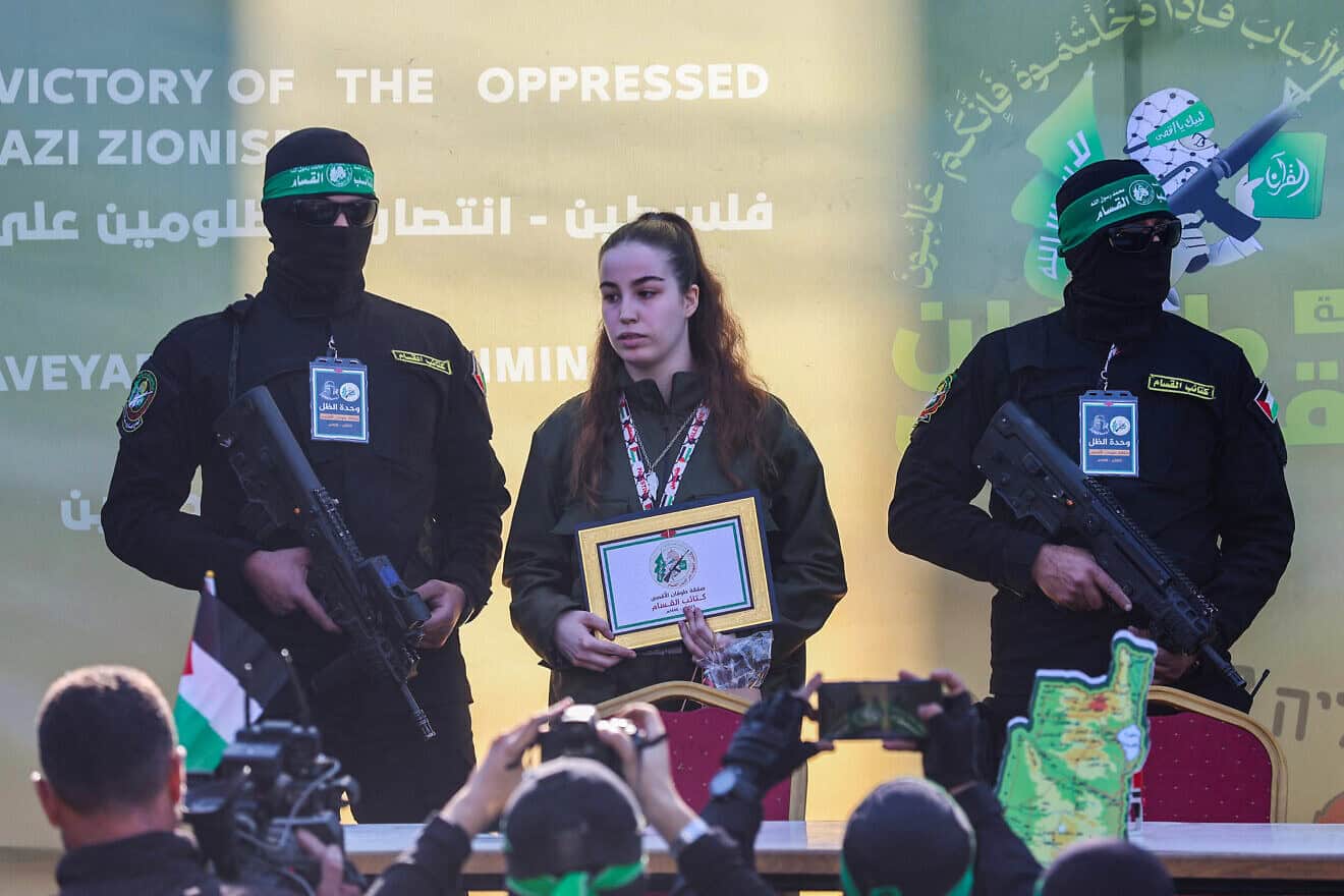 Israel Defense Forces hostage Agam Berger surrounded by Hamas terrorists before being handed over to a Red Cross team in northern Gaza, Jan. 30, 2025. Photo by Omar al-Qattaa/AFP via Getty Images.