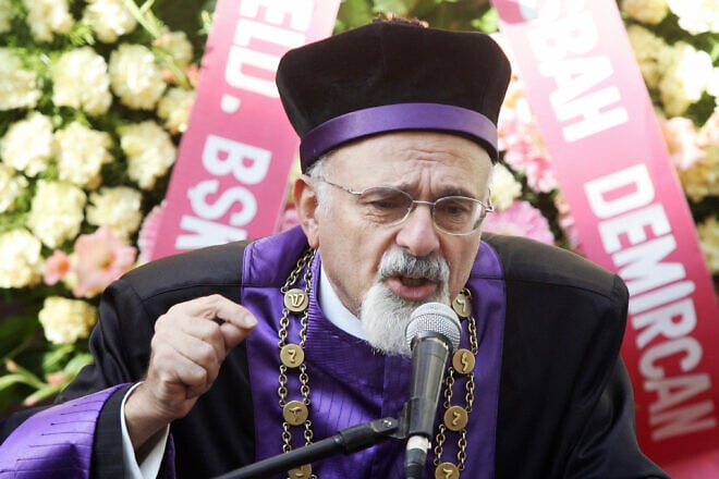 Ishak Haleva, the chief rabbi of Turkey, gives a speech in front of the Beth Israel Synagogue in Istanbul commemorating the first anniversary of suicide bombings against two Istanbul synagogues, in a wave of attacks that left 60 people dead in the space of a week, on Nov. 15, 2006. Mustafa Ozer/AFP via Getty Images.